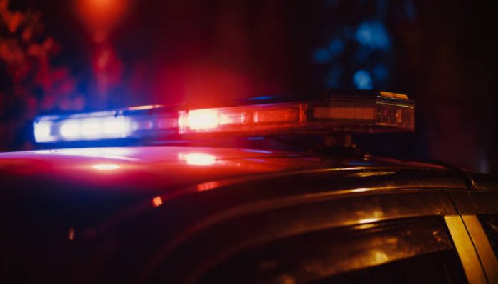 Close-up Shot of Police Car Siren Lights. Offices of the Law Ready for Action, Chase the Criminals, Arrest Offenders and Fight Crime. Stylish Cinematic Lights with Dark Sky